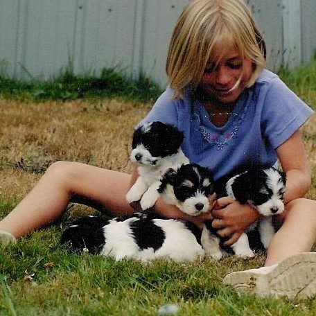 Kid with puppies
